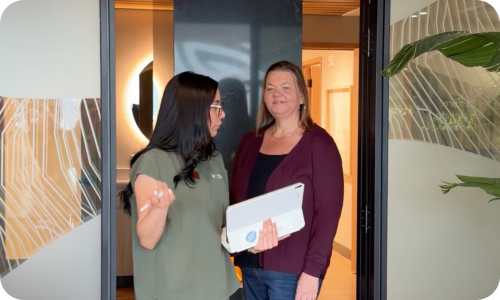 Two women talking at work