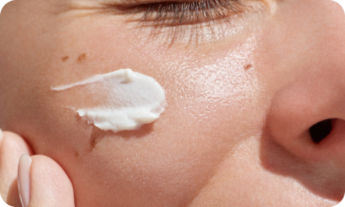 A person applying lotion