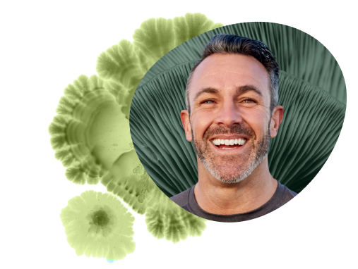 Young bearded man smiling.